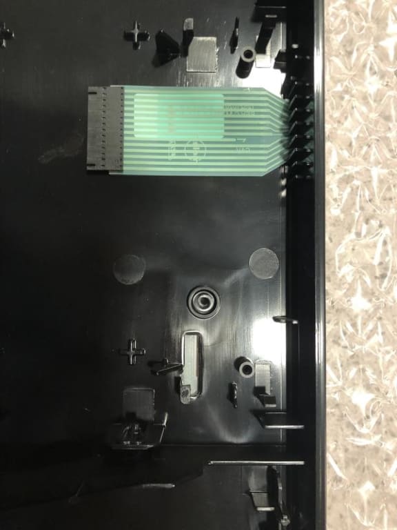 The damaged part. There is a ribbon cable missing. The next photo shows my old panel with both ribbon cables. The damaged part. There is a ribbon cable missing. The next photo shows my old panel with both ribbon cables.
