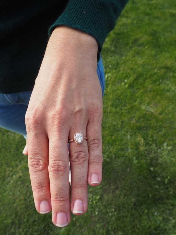 Oval diamond ring on hand