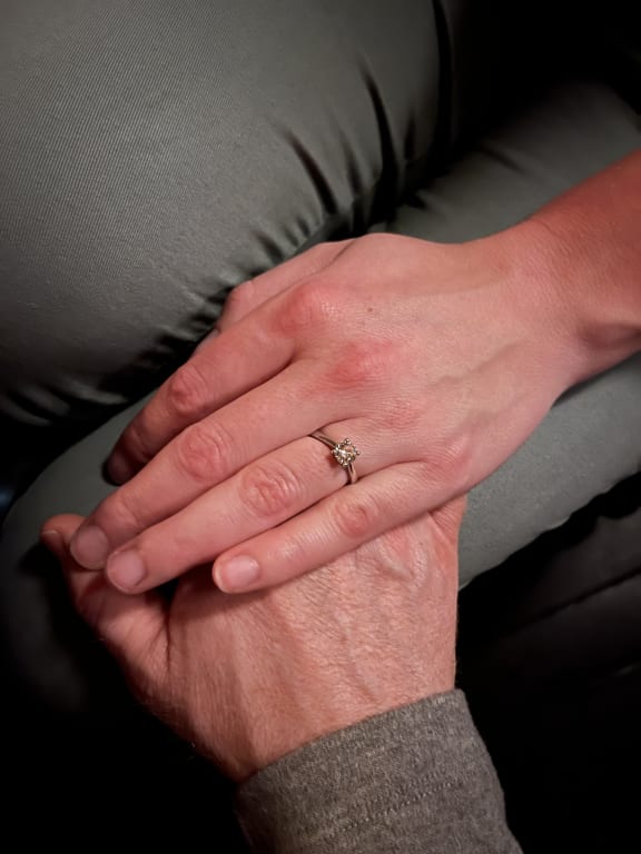 Oval diamond ring on hand