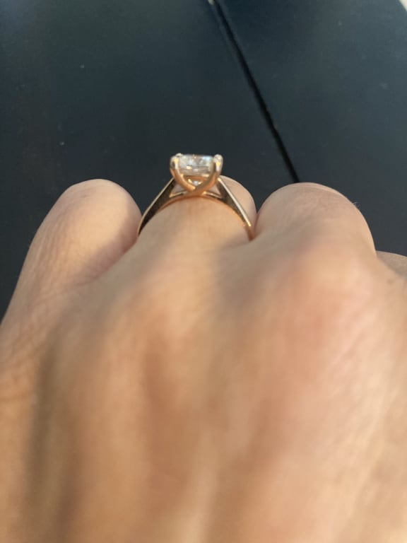 Oval diamond ring on hand