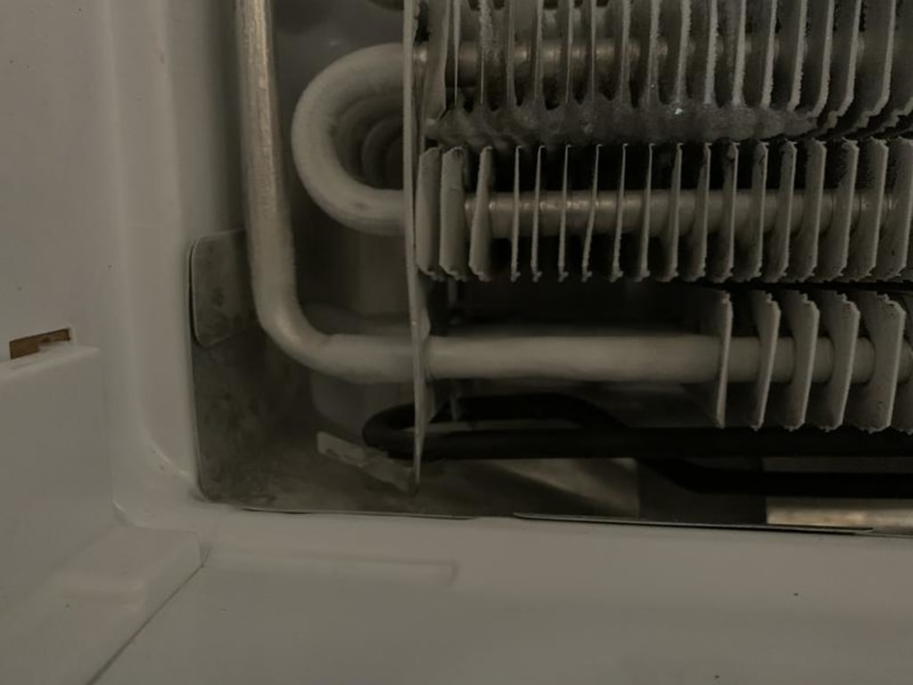 Opposite side from connections, you will need to carefully bend the metal supporting the heater to allow it to drop free. It's like this on both ends. Opposite side from connections, you will need to carefully bend the metal supporting the heater to allow it to drop free. It's like this on both ends.