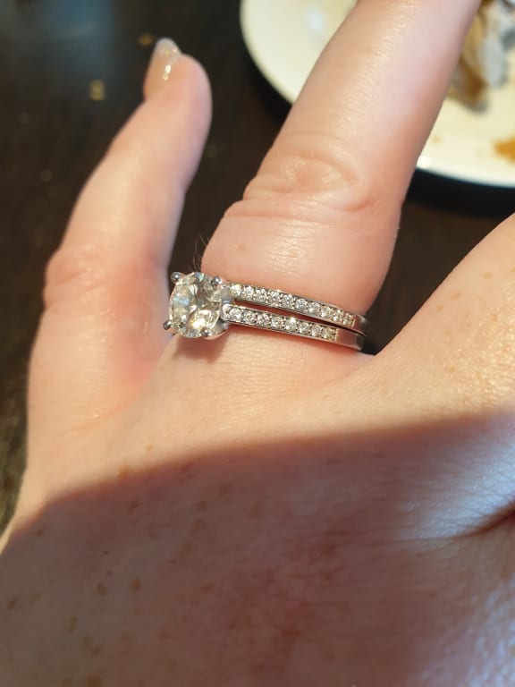 Oval diamond ring on hand