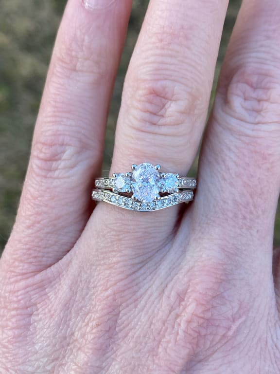 Oval diamond ring on hand