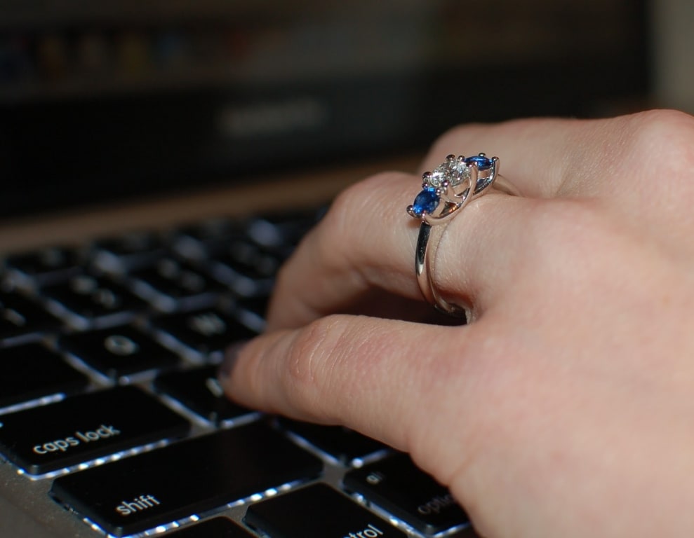 Oval diamond ring on hand