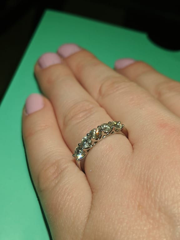 Oval diamond ring on hand