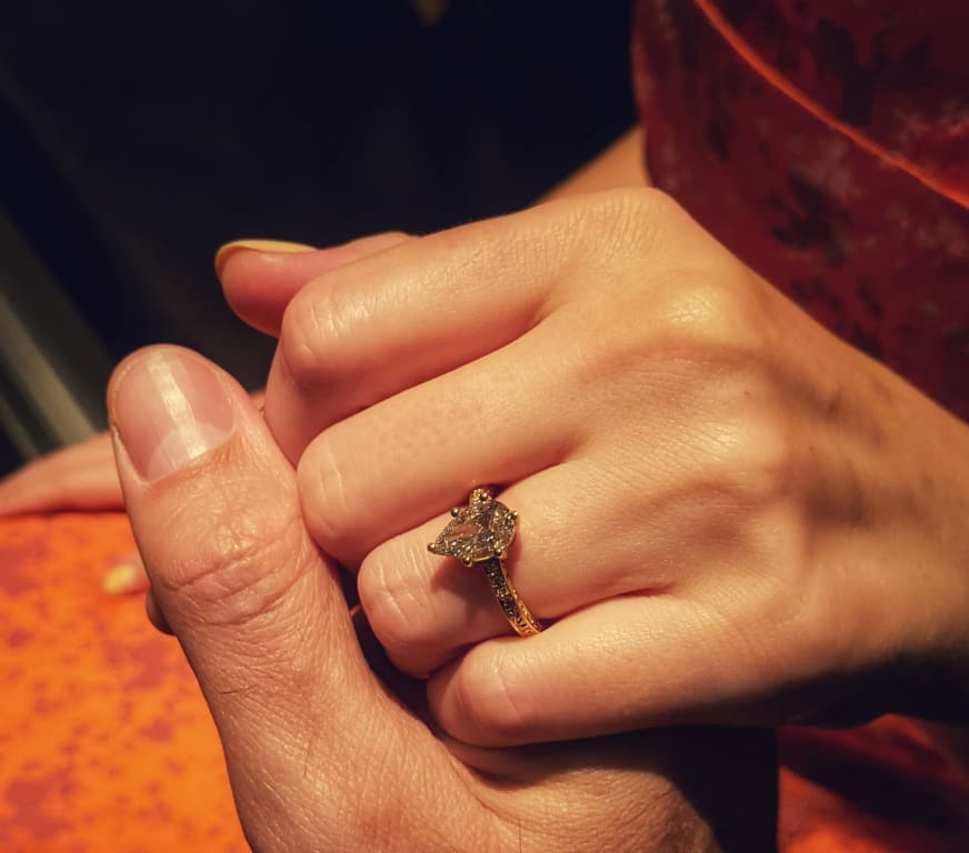 Oval diamond ring on hand