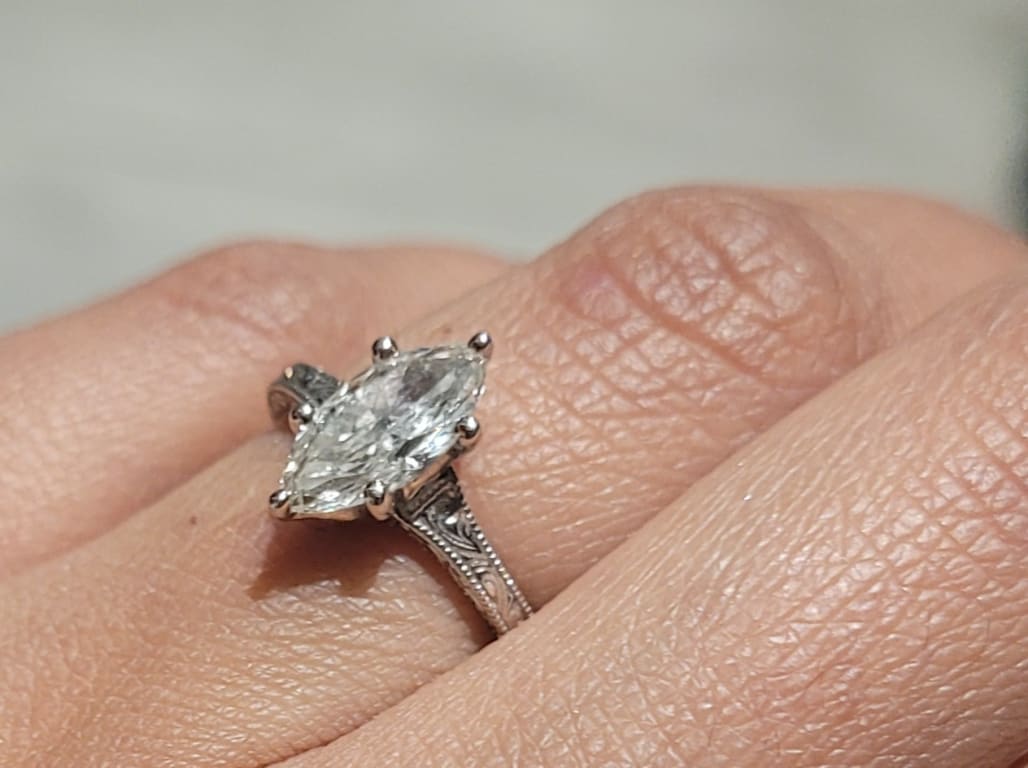 Oval diamond ring on hand