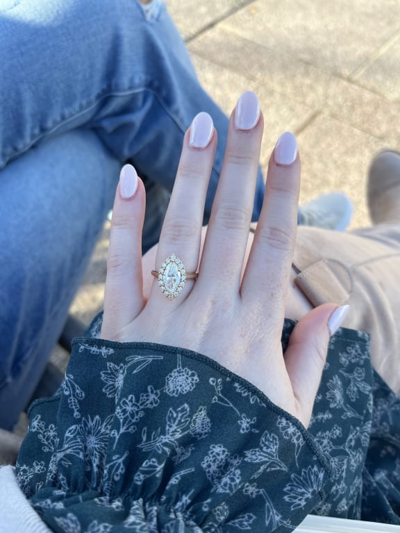 Oval diamond ring on hand