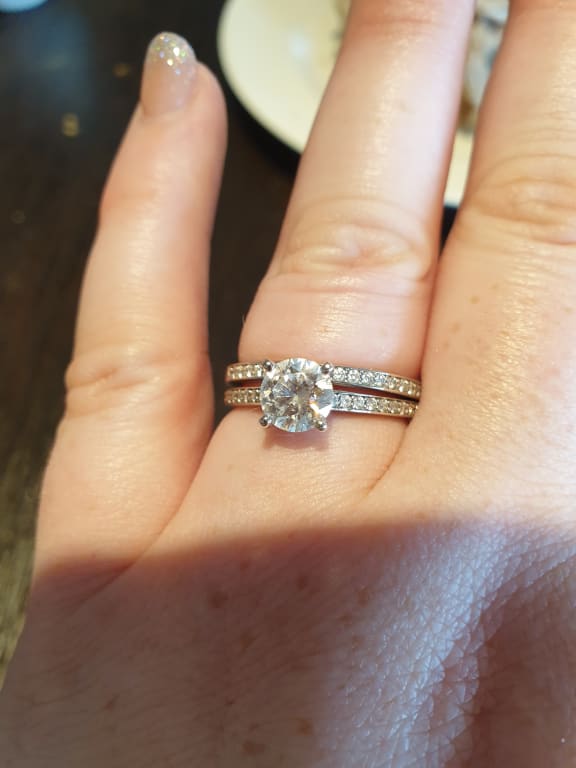 Oval diamond ring on hand