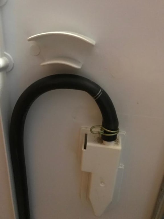 Hose should fit in the slot above it Hose should fit in the slot above it