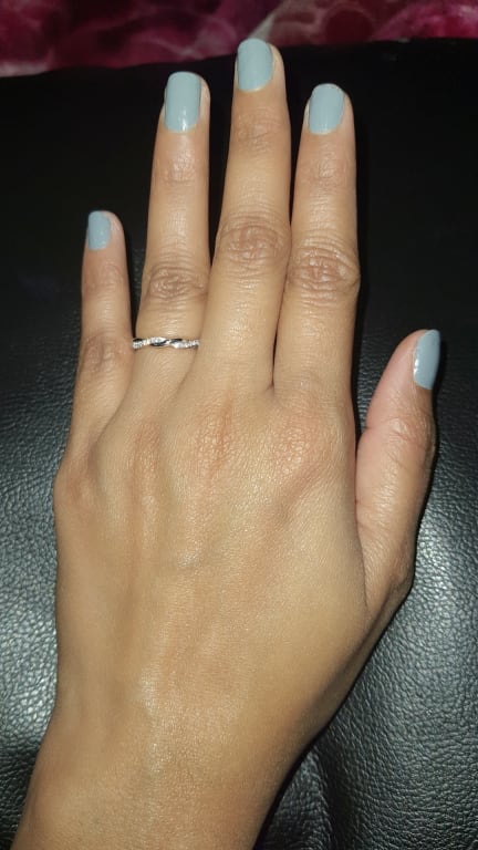 Oval diamond ring on hand