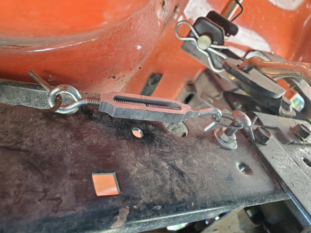 Turnbuckle to increase spring tension Turnbuckle to increase spring tension