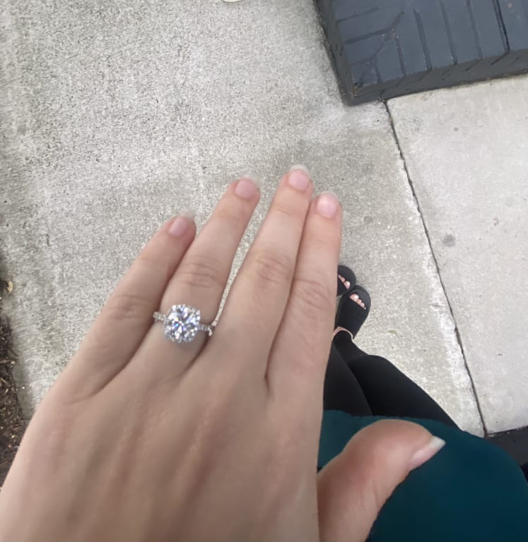 Oval diamond ring on hand