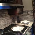 Smoke going through the light in the range hood and up the cabinet door