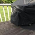 Velcro straps on the grill cover at each end