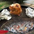 Beer can chicken with sides in foil.