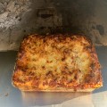 Homemade Lasagna baking in the Wood Fired Oven