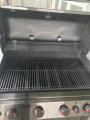 Multiple cooking surfaces allows varied heat for use in conducting large or small items to grill together.