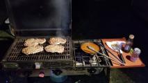 Rib Eyes on the grill-box and Bush's beans are the guys part - the girls are fixing the other half of the dinner. Beer is for fire-duty if we get a flare-up!