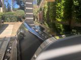 Dent in cover, front foreground
