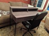 Tall enough that an office chair can fit underneath without hitting the arms.