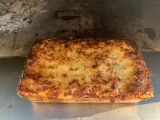 Homemade Lasagna baking in the Wood Fired Oven