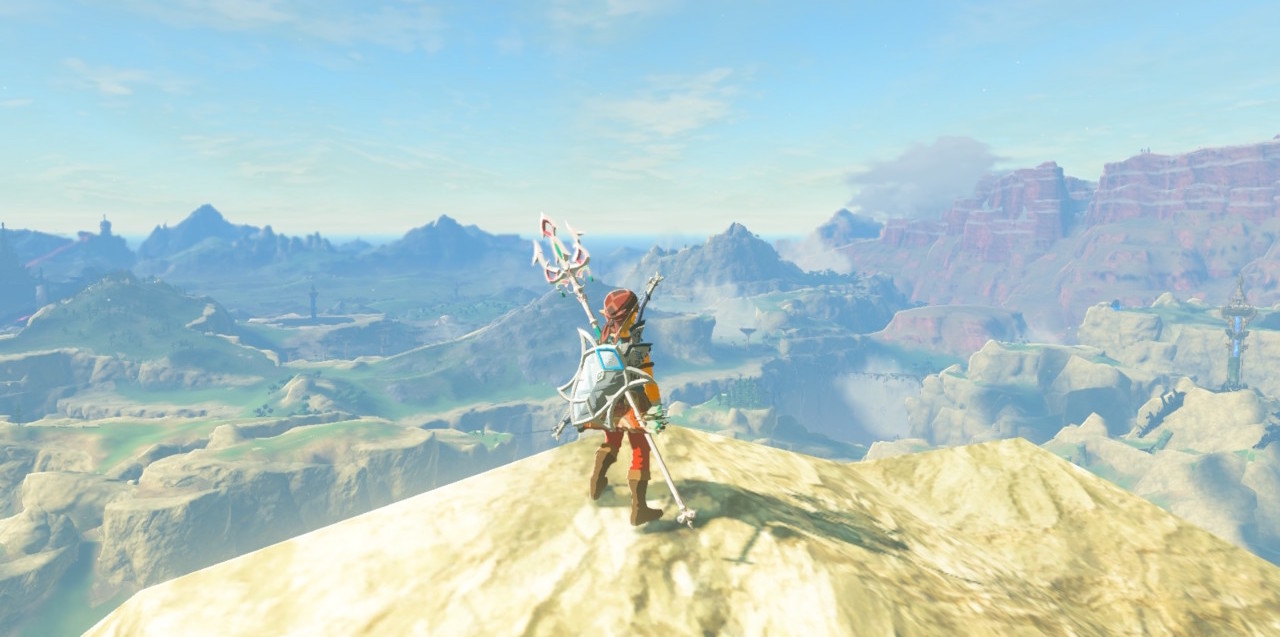 Link surveys Hyrule from the rock above Rito Village in Breath of the Wild