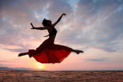 Jumping Woman at Sunset