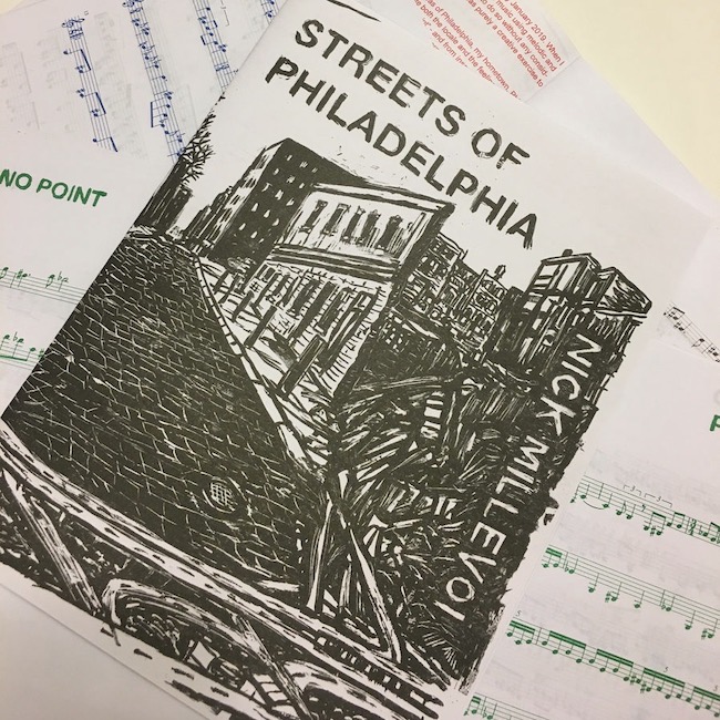 Streets of Philadelphia song book open on table