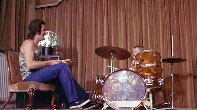 john bonham sitting next to jason bonham who is sitting behind the vistalie kit playing it