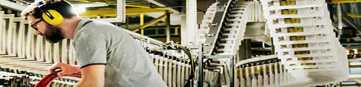 Man on a production line concentrating