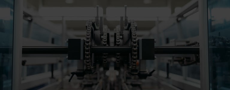 Mechanical cogs and chains on a production line
