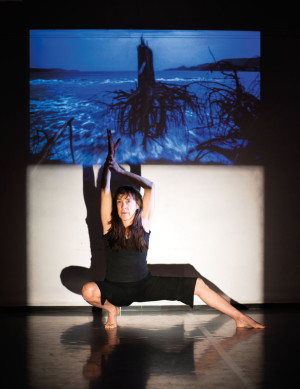 Linda Austin’s re-creation of her debut work involves posing with a series of slides.
