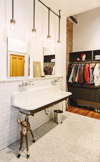 Iosca repurposed a vintage urinal from Rejuvenation Lighting and House Parts for a bathroom sink