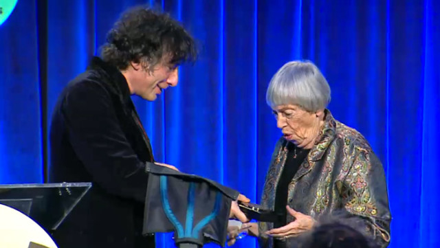 Ursula K Le Guin accepts the the 2014 Medal for Distinguished Contribution to American Letters from fantasy best-seller Neil Gaiman