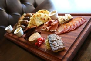 Bell and Whete's food menu, including this charcuterie sampler called Tour de Viande, displays the diversity of the cuisine created by the Normans' European and Mediterranean conquests in the 10th and 11th centuries.