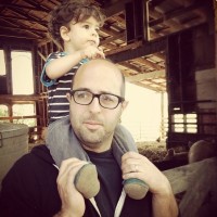Ian Hutchings at Afton Field Farm in Corvallis with his son, Atticus.