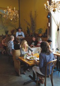 Chef Jason French roams the dining room at Ned Ludd