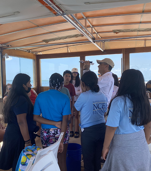 image of children learning on a boat