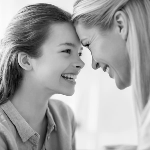 mother and daughter laughing