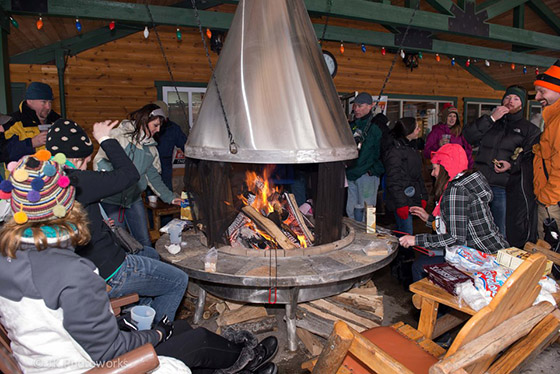 Guests enjoy the fire at the 2013 Suds & Snow Celebration at Timber Ridge