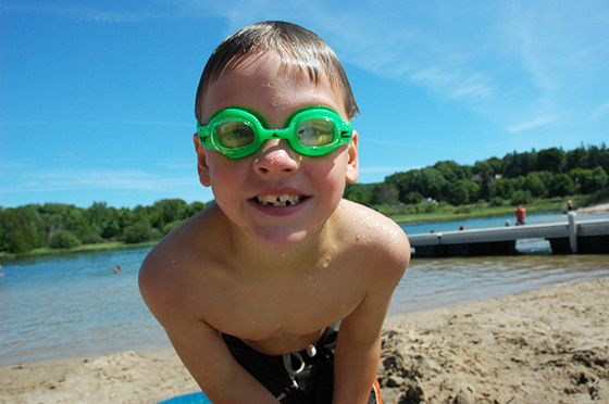 Child playing on the beach at North Bar Lake near Traverse City