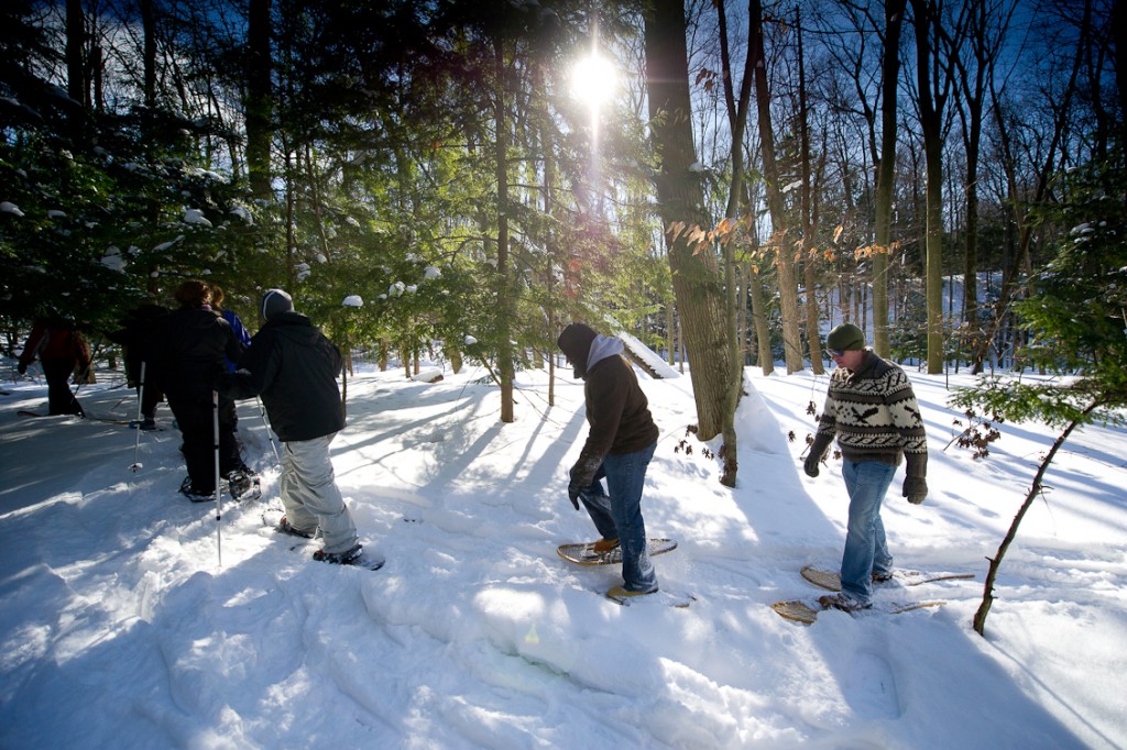 People snowshoeing in Hoffmaster State Park