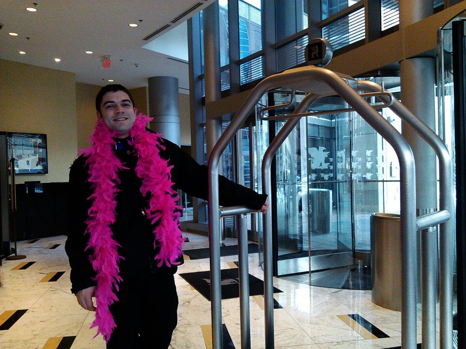 JW Marriot staff member wearing a pink boa