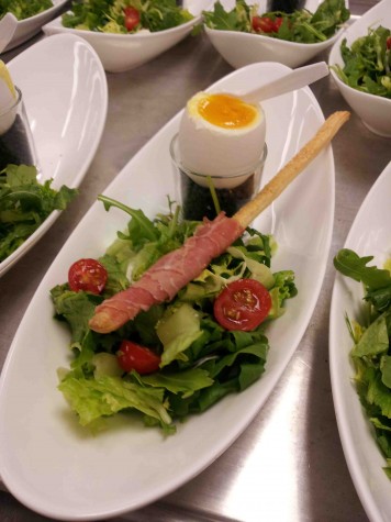 Amway Grand Plaza's Mixed green salad with a prosciutto wrapped crostini and a poached egg