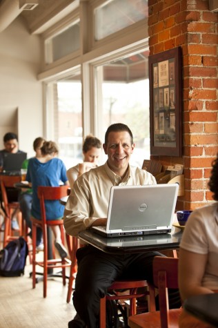 Dave Serino on a laptop in a cafe Dave Serino