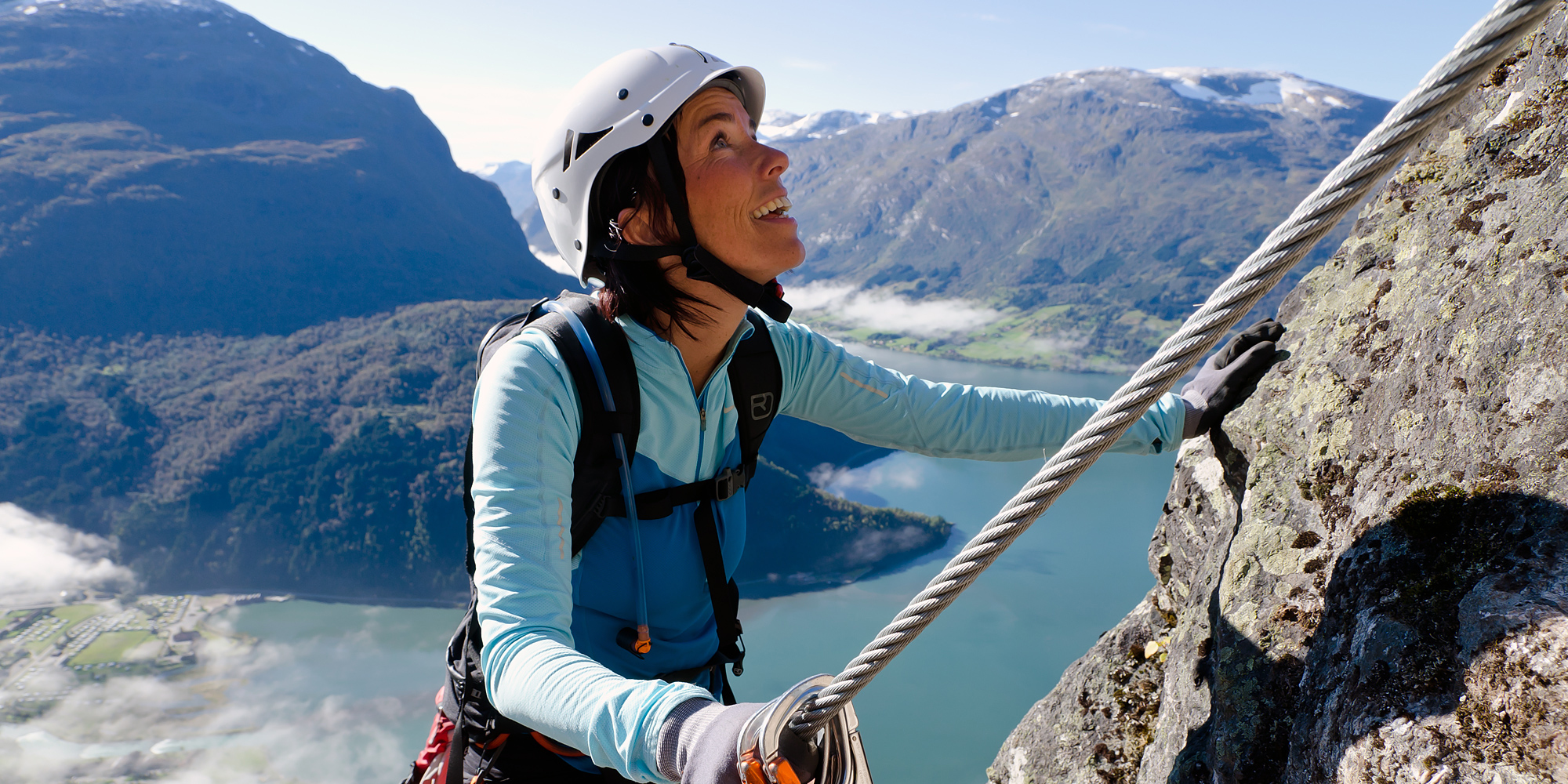 Beautiful athletic woman rock climbing wearing nothing but a bikini with  harness and climbing shoes - Playground