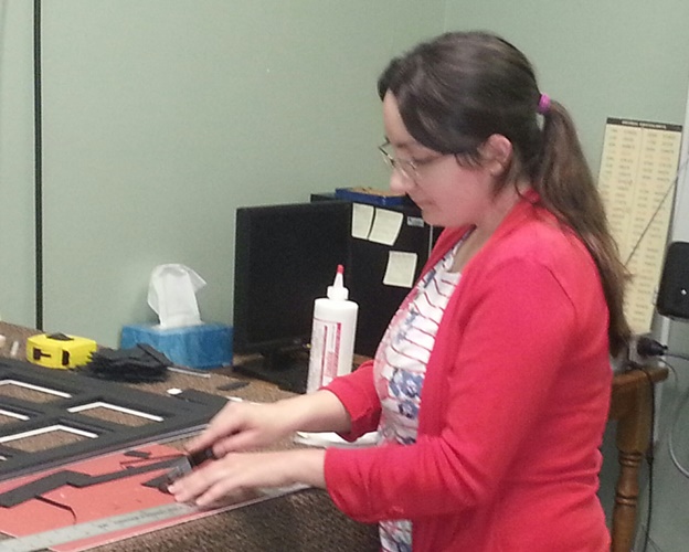 Mandy Bouso works on a frame at Artistic Designs Gallery's new location in Brownsburg. Artistic Designs Gallery in Brownsburg, Indiana
