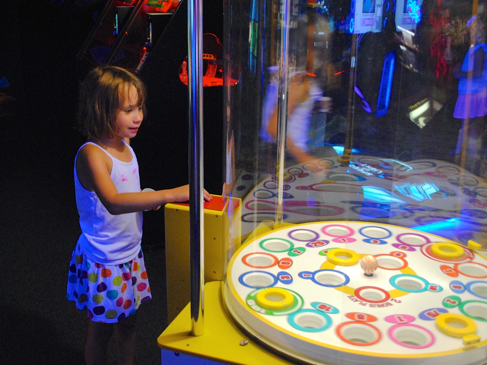 My daughter enjoys playing games at Monster Mini Golf in Avon