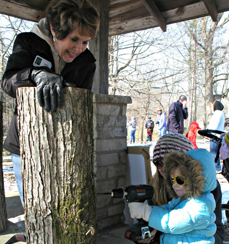 This tree-tapping station is a popular stop for children of all ages. Maple Sirup Days, Hendricks County, Indiana